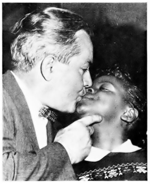 Gino Prato gives Gloria Lockerman a good luck kiss. - Jet Magazine, September 15, 1955